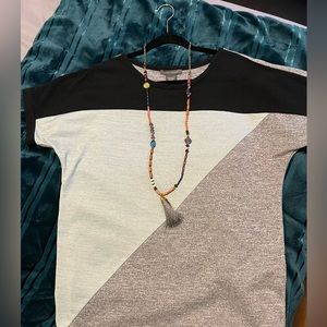 Selling a loose short sleeve top.